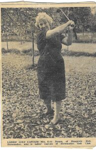 black and white photo of a lady golfer