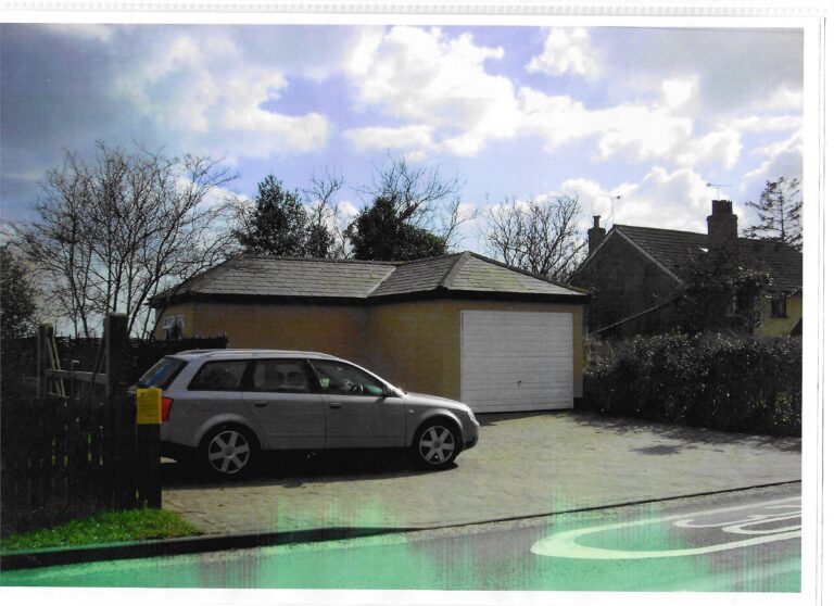 colour photo of car and building
