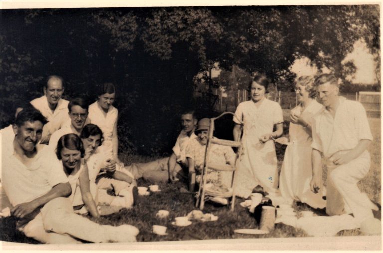 men and women having a picnic