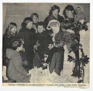 1967 Father Christmas delivering presents to children